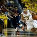 Michigan sophomore Trey Burke drives past Illinois defenders in the game on Sunday, Feb. 24. Daniel Brenner I AnnArbor.com